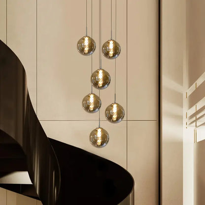 Moderne Sferische Hanglamp met Meervoudige Amber Glazen Bollen